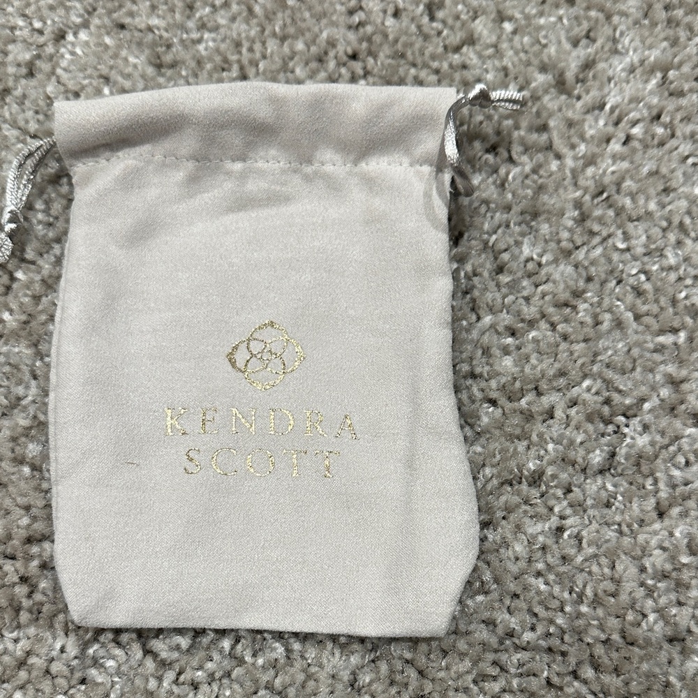 Kendra Scott Cream Pouch with Gold Logo